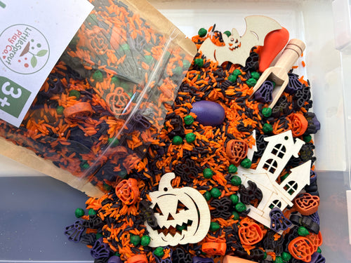 Halloween ready-to-pour sensory play kit with festive coloured filler and Halloween play pieces.